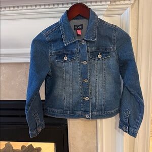 Place children’s denim jacket size 10/12